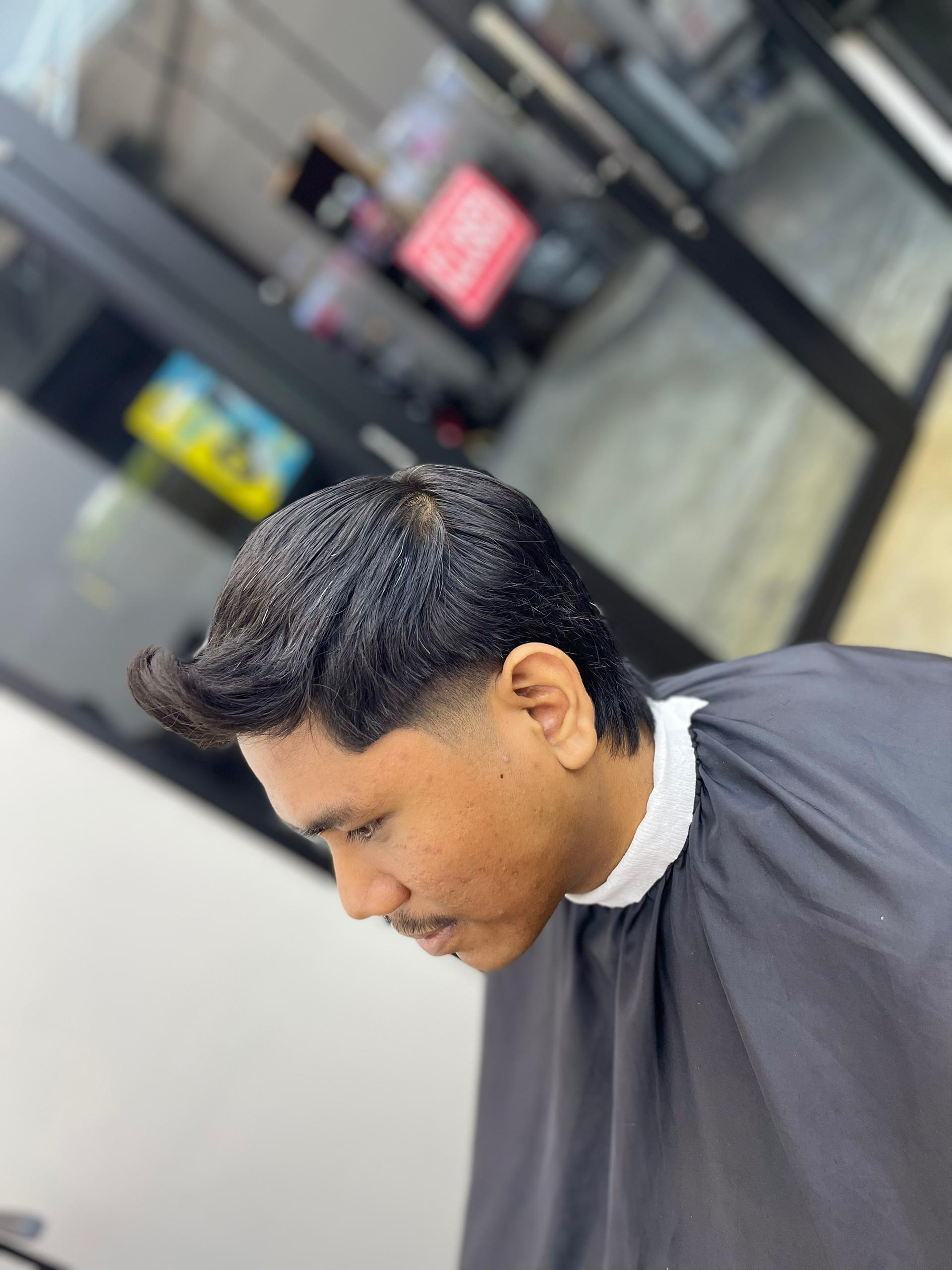 Low fade slickback by Nawaz